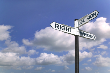 Concept image of a signpost with Decision Right or Wrong against a blue cloudy sky